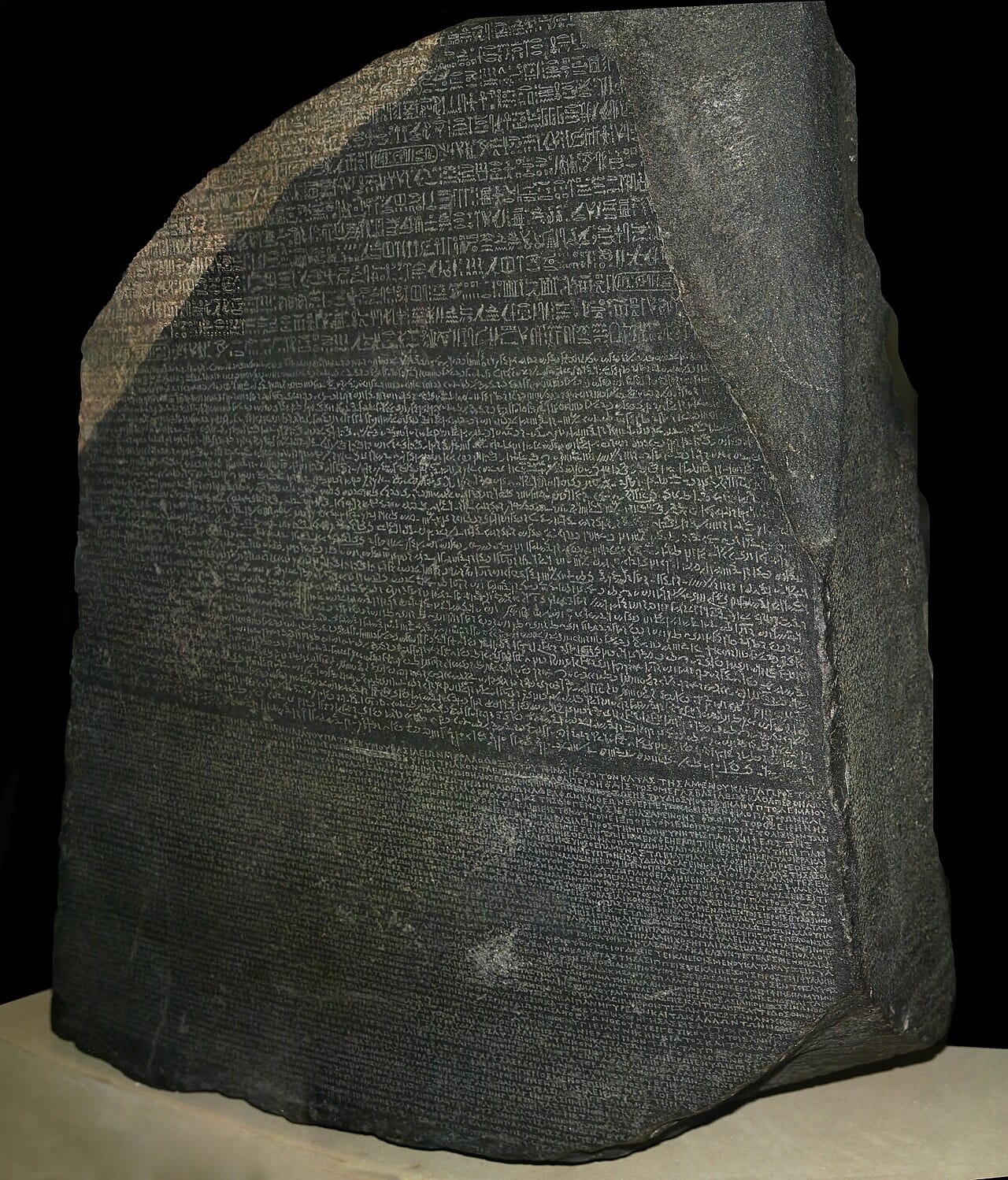 Photograph of the Rosetta Stone with inscriptions in multiple languages.